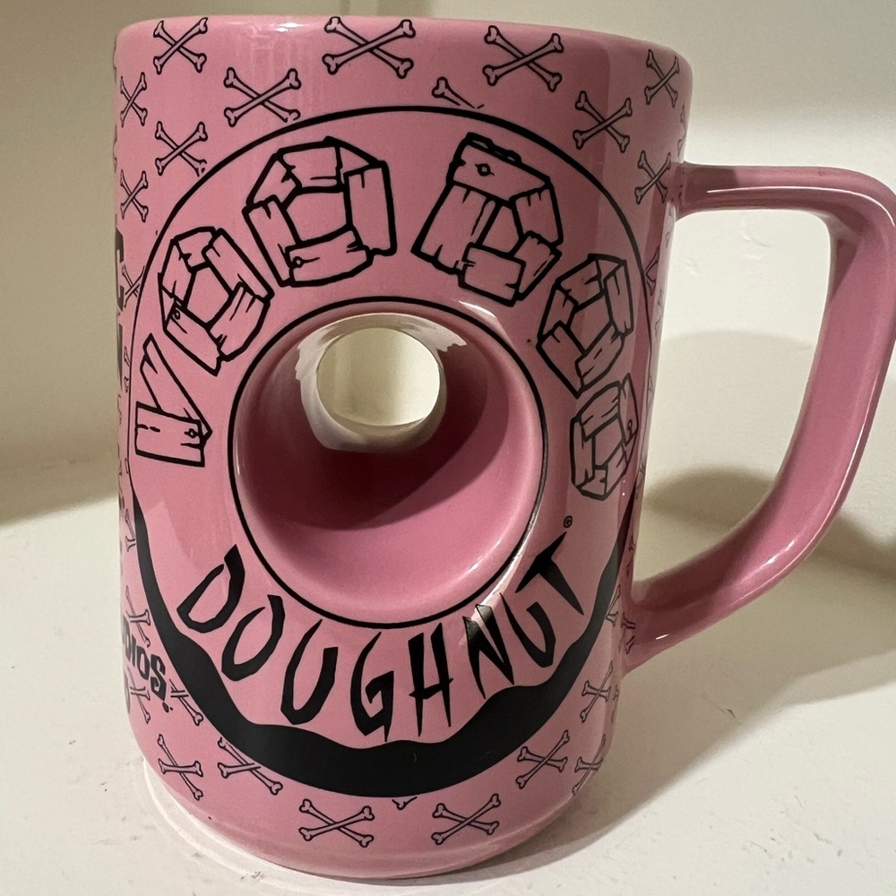 Voodoo Donuts coffee mug. Tall measuring 5” and 3.5” across top.